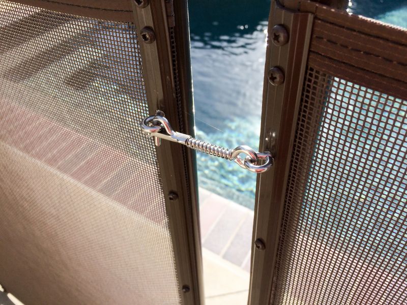 Mesh Fence Secured to Pool Deck